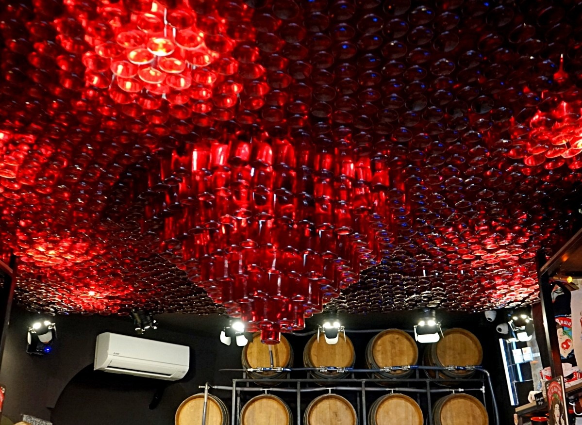 Ceiling made of the bottles with the cherry tincture at Drunken cherry