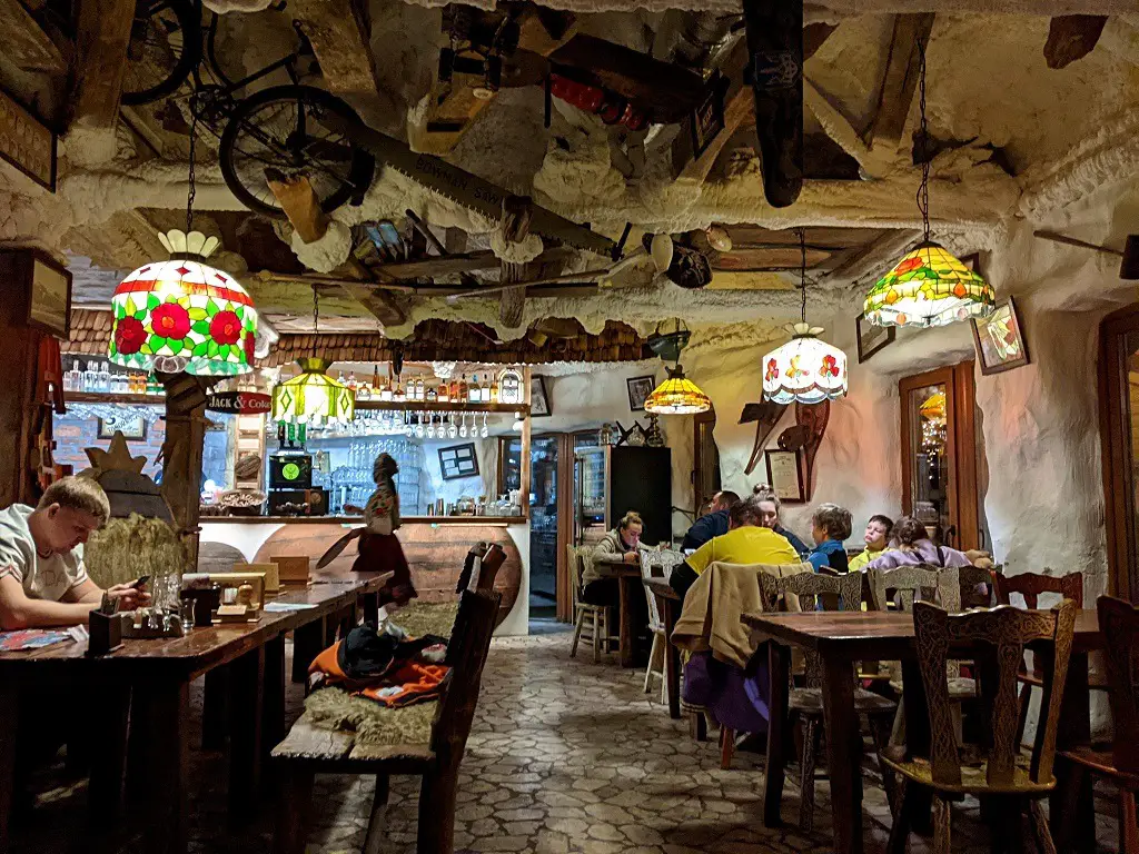 The interior of the restaurant is a mix of a Crazy grandma's house and a travertine cave 