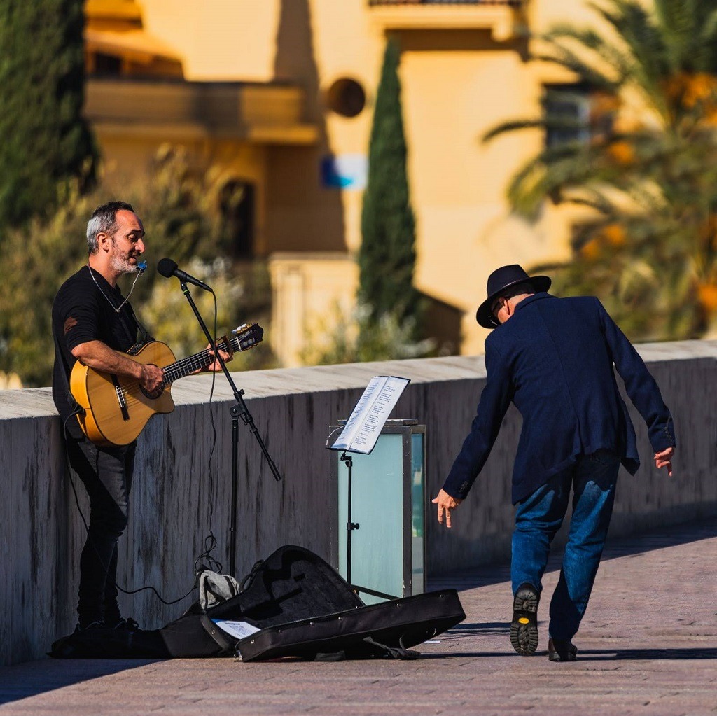Stroll Along The Roman Bridge And Enjoy The Performance of The Street Musicians 